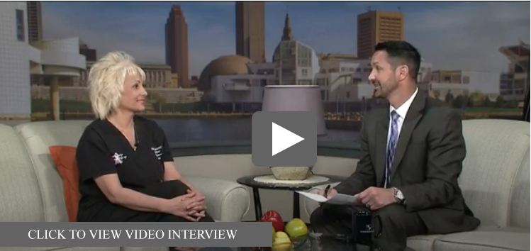 Denise George interviewed on WKYC's Lakeside Today set with a Cleveland skyline backdrop